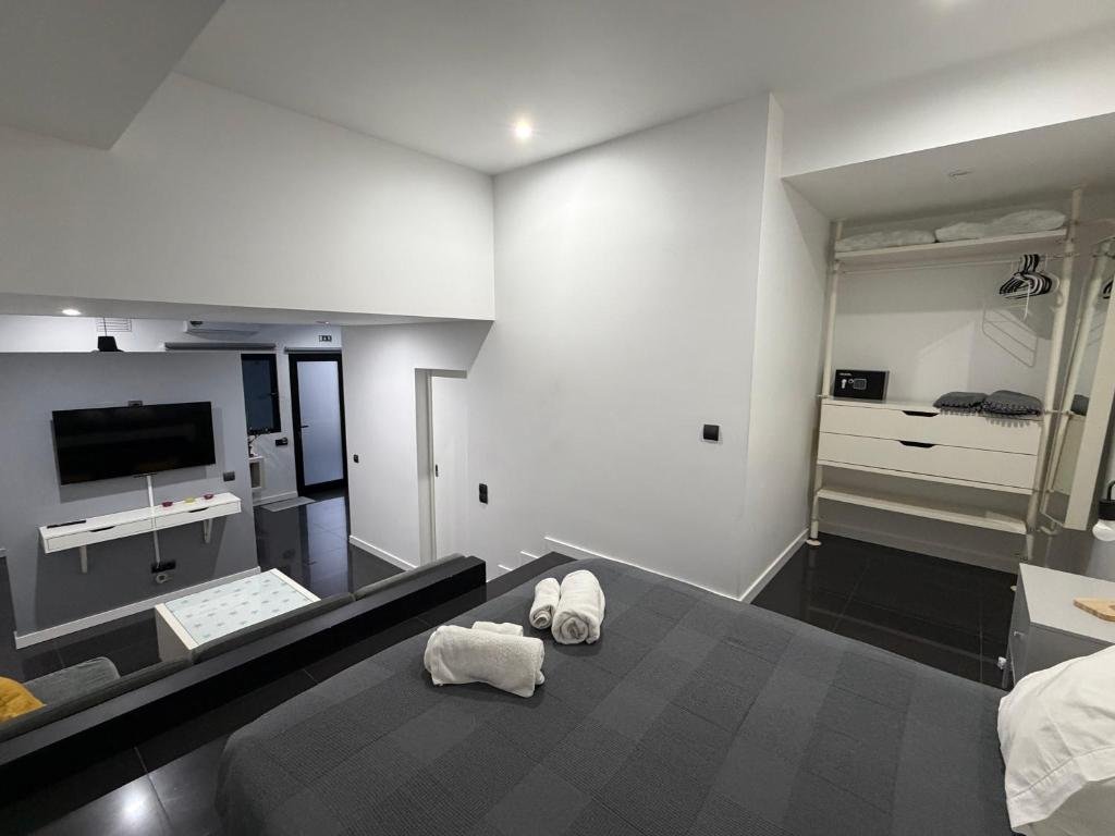 Studio — cama e zona de arrumação
